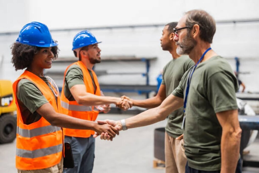 Tree service professionals shaking hands with clients during a project discussion in Willoughby Hills, OH